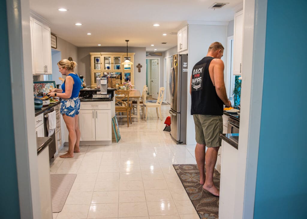 Husband & wife cooking in the kitchen