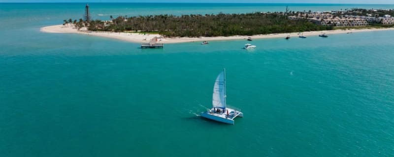 Aerial view of Fort Myers shoreline and turquoise water, one of the best beaches near Cape Coral.