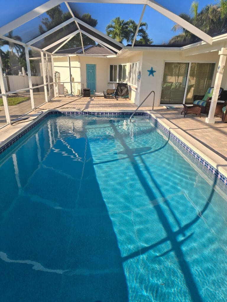 Screened lanai pool at a Cape Coral vacation home enjoying the warm Cape Coral climate