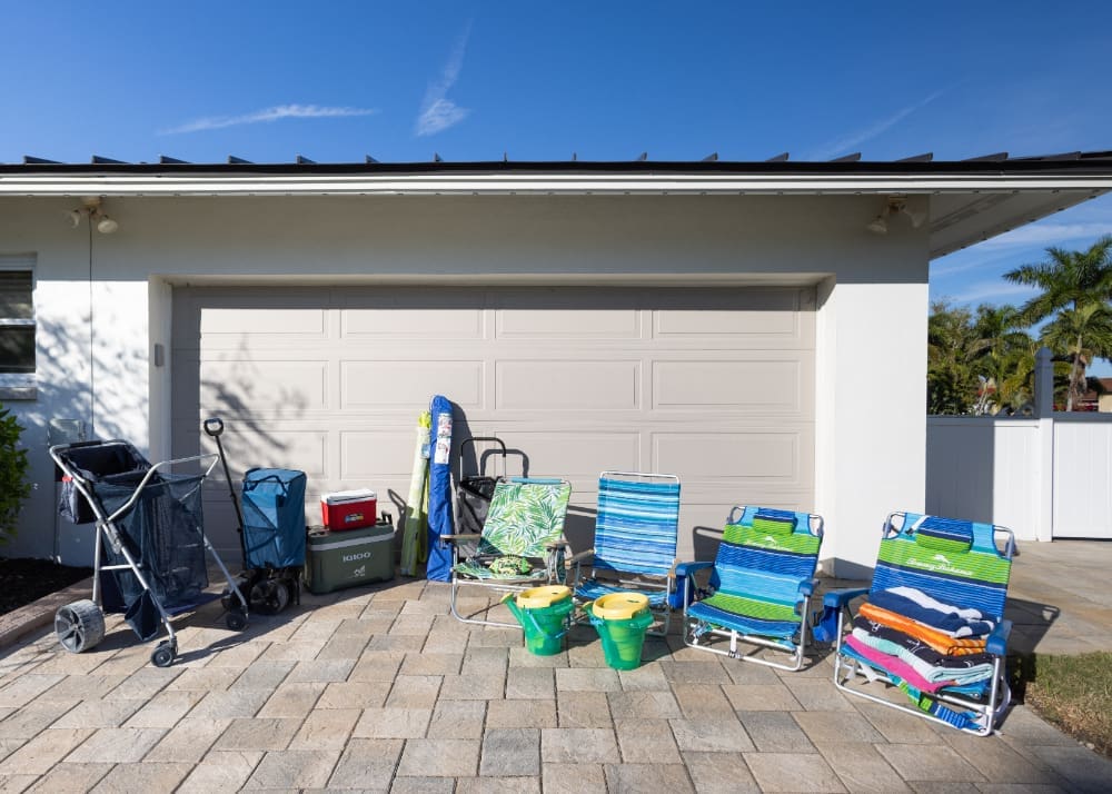 Beach chairs, towels, a wagon, cooler, and sand toys are provided for guests at South Del Prado Point in Cape Coral, making family beach days easier and helping visitors spend less time packing and more time enjoying Southwest Florida.